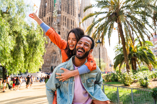 Multiracial beautiful happy couple of lovers dating in Barcelona