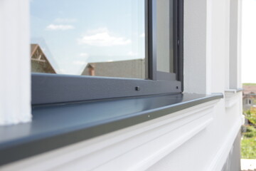 Fototapeta premium Close-Up of Modern Window Frame with Reflections