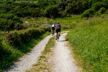 Obraz premium A person cycling on a rural route