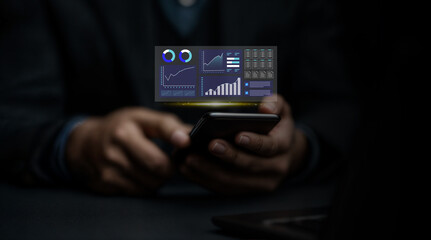 Business professional analyzing financial data, charts, and analytics on a futuristic digital device with holographic interface for performance tracking and decision making.