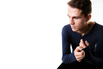 man portrait close up on white studio background with hands high near head while look to side and be depressed, worried and thoughtful