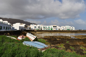 Fshing boats and white houses in Orzola, picturesque fishing village and the northernmost settlement of Lanzarote, canary islands, spain, travel europe