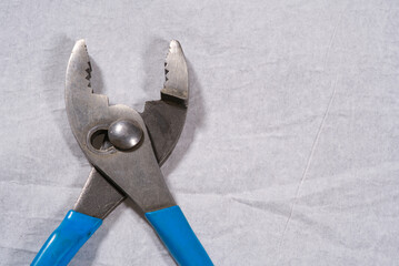 Slip joint pliers on a white background close up hand tools