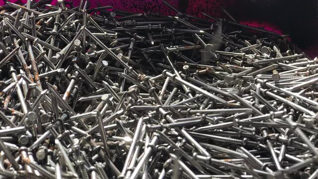 Double Headed Nails Falling in Slow Motion