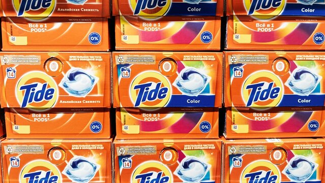 Tide laundry detergent capsules in brightly colored packaging, showing off their colorful design and branding. Gomel, Belarus - February 15, 2025