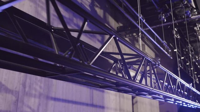 A Large Theater Truss is Slowly Lifted up with Several Sturdy Metal Cables. Lighting or Stage Truss Allows Lighting Designers the Freedom to Hang LED or Automated Fixtures, Where Ever they Choose.