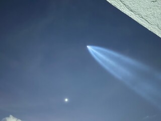 ufo flying above the clouds