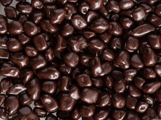 Lots of brown chocolates. Background, texture, lots of sweets.