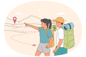Couple of tourists went hiking and look at hills choosing best path or route to reach their goal