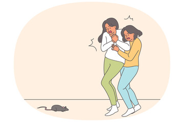 Frightened women scream at sight of mouse or rat running past, suffering from musophobia