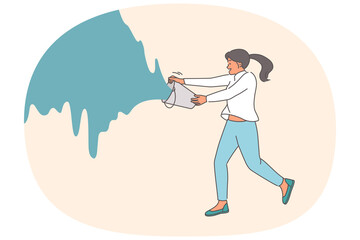 Woman pours bucket of paint onto wall, wanting to express creativity or repaint surface