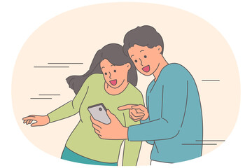 Man shows mobile phone with new apps to girlfriend, boasting about great purchases in online store