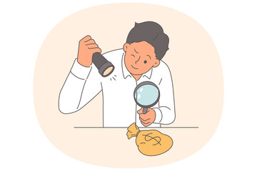 Business man looks at small bag of money after receiving first profit from startup