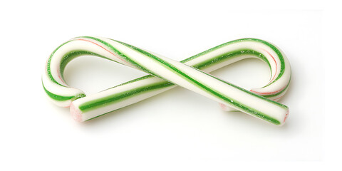 Naklejka premium Two candy canes with green and white stripes crossed against a plain white background.