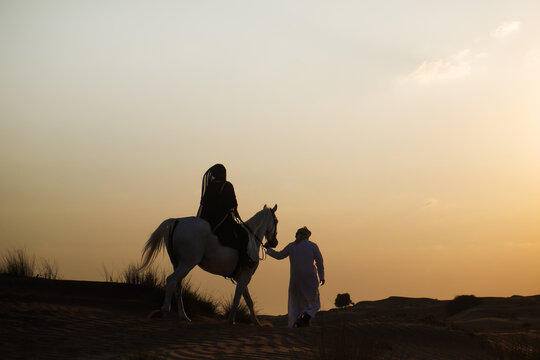 Bedouins at Sunset in the Desert 