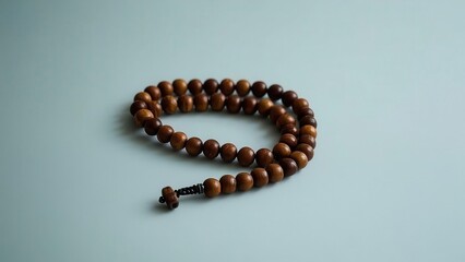 Wooden Prayer Beads on a Light Blue Background