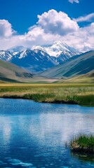 Beautiful Mountain Landscape Reflecting on Calm Water With Vibrant Blue Sky and Fluffy White Clouds in the Background