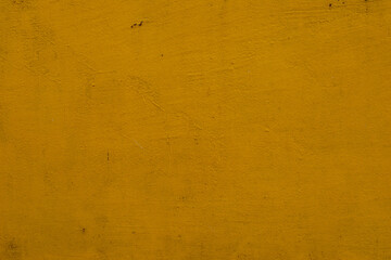 Vibrant yellow textured surface showcasing a unique artful appeal in a warm setting