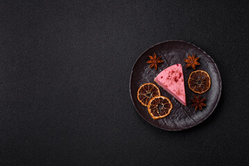 A piece of sweet cheesecake with raspberry or strawberry flavor