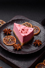 A piece of sweet cheesecake with raspberry or strawberry flavor