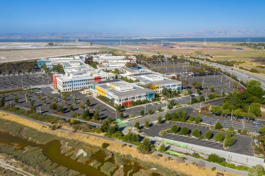 Facebook Meta Headquarters campus, expansive parking lots, and surrounding nature. A bird's-eye view of the company's facilities. ,Menlo Park, California, USA. 18 June 2024