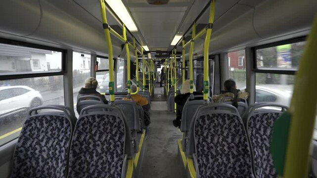 Germany, Berlin. Municipal bus BVG, Berliner Verkehrsbetriebe view from inside from passenger seat. Interior of yellow city bus on route in Berlin. Public transportation in Germany. 