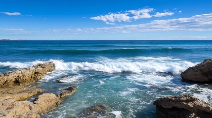 Scenic Ocean Waves Crashing on Rocky Shore with Bright Blue Sky and Clouds : Generative AI