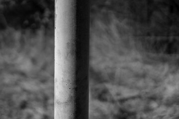 Pillar in the Park. Blurry Background.