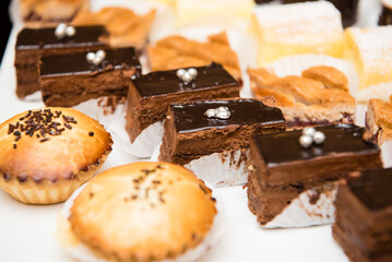 Arrangement of chocolate cake, cookies, and other desserts.