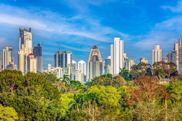 View of the skyline of Panama city behind the tropical rain forest along the shores to the Pacific entrance to the Panama Canal