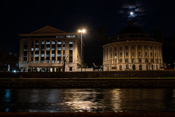 The headquarters of Water Supply and Sewerage Skopje illuminated at night. This modern building serves as the main office for the city's water management services.