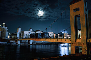 A nighttime view of Macedonia Square, the central plaza of Skopje. Illuminated buildings, monuments, and fountains create a vibrant atmosphere in the heart of the city.