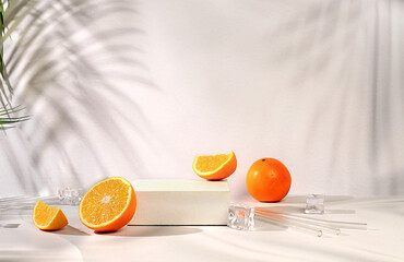 Premium podium with shadows, orange slices and ice cubes on sunny elegant background, summer party concept, minimal abstract background for cosmetics product presentation, design template,