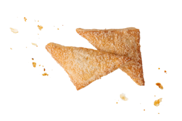 Whole fresh baked pastry puff pie apple turnover with crumbs flying isolated on white background.