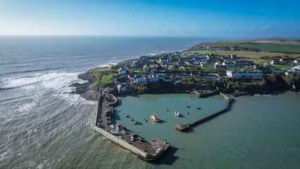 Aerial view of Ballycotton village and pier, County Cork, Ireland, showcasing the charming coastal fishing village along the rugged Atlantic shoreline