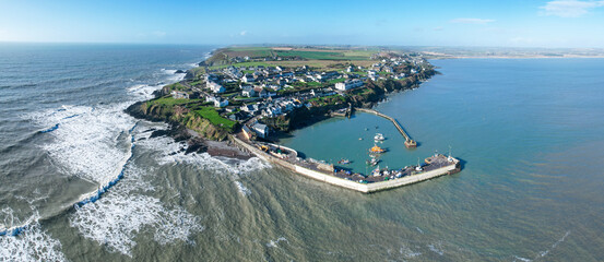 Aerial view of Ballycotton village and pier, County Cork, Ireland, showcasing the charming coastal fishing village along the rugged Atlantic shoreline