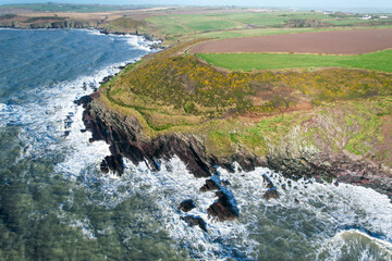 Aerial view of the Ballycotton Cliff Walk, County Cork, Ireland, showcasing the stunning coastal trail along rugged cliffs overlooking the Atlantic Ocean