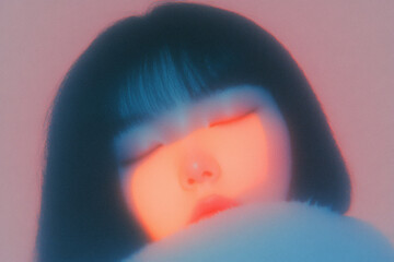 Soft-focus portrait of a person with closed eyes, featuring pastel colors with warm undertones.