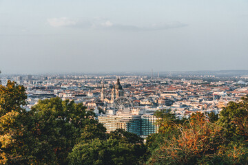 Obraz premium panorama of budapest with ferry wheel and big cathedral church over the city roofs