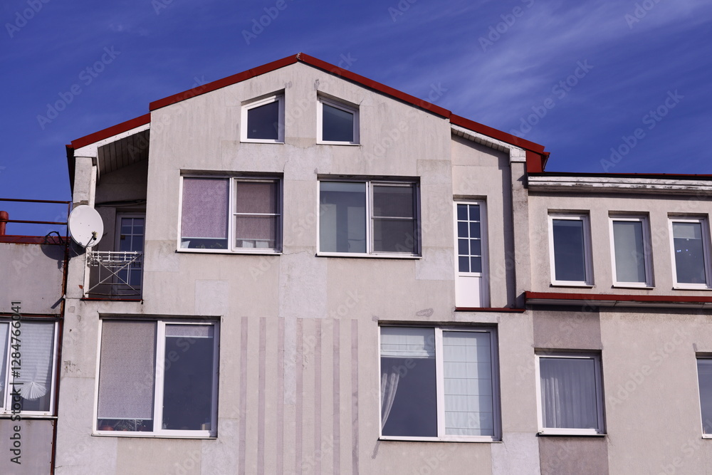 Poster a building with a satellite dish installed on its rooftop, suitable for use in scenes about technolo