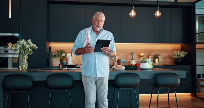 Senior man, home and tablet for recipe, food website and online tutorial for healthy meal guide. Elderly person, retirement and thinking on nutrition in kitchen, ingredients plan and instructions