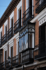 Beautifully designed balconies of a historic building in Madrid showcase intricate ironwork and classic architecture
