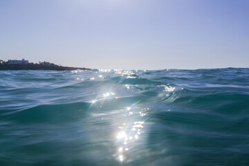 Sunlit ocean waves, Paphos, Cyprus – November 23, 2024..