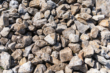 Pile of crushed gray stones for construction