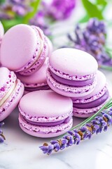Fototapeta premium Sweet lavender macarons arranged beautifully with purple flowers on a marble surface during a sunny afternoon