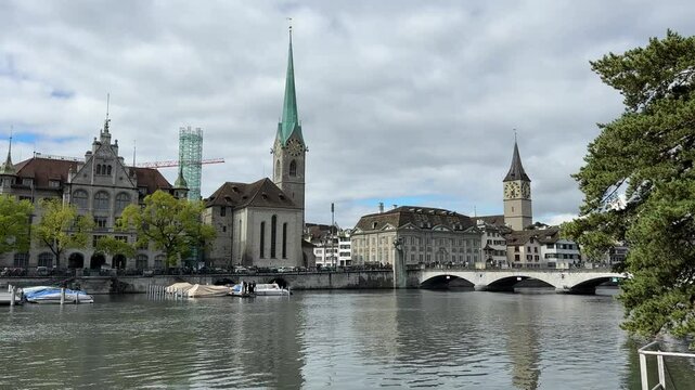 Zurich, Switzerland - 05 10 2024: Zurich city center with Fraumunster church and Munsterbrucke, Switzerland, Limmat river