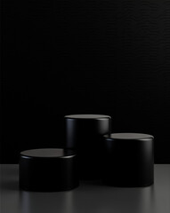 three sleek black cylindrical platforms on a dark background