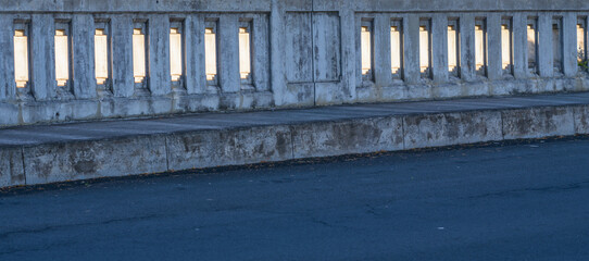 Ancient Stone Bridge Railing on an Old Roadway.