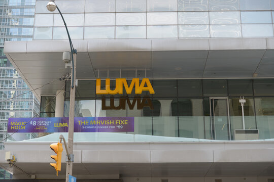 exterior building facade and sign of Luma, a restaurant, located at 350 King St W 2nd Fl of Reitman Square, Floor 1 of Festival Tower in Toronto, ON