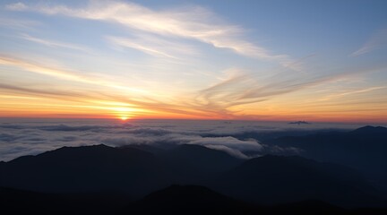 Obraz premium Sunrise Over Beautiful Mountains With A Wide-Ranging Cloudscape